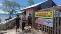 Spanduk berisi peringatan ancaman buaya dipasang di kawasan Pelabuhan dan pantai