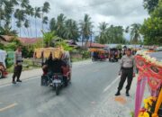 Puluhan Personel Polres Touna Kawal Kegiatan Karnaval Roda Hias Meriahkan HUT Touna Ke-21