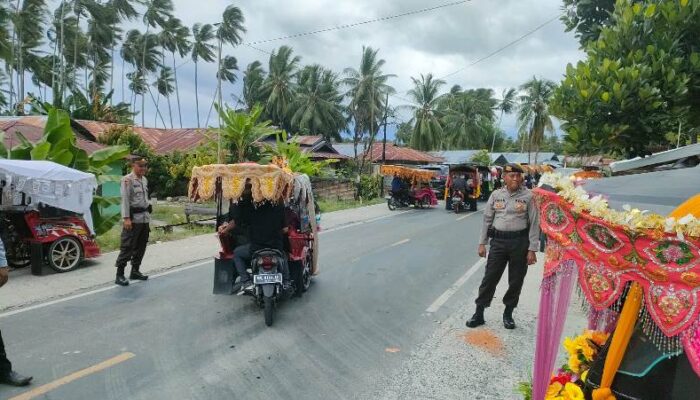 Puluhan Personel Polres Touna Kawal Kegiatan Karnaval Roda Hias Meriahkan HUT Touna Ke-21