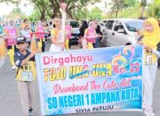 Meriahkan HUT Ke-22 Kabupaten Touna, Sekda Alfian Lepas Parade Defile Marching Band