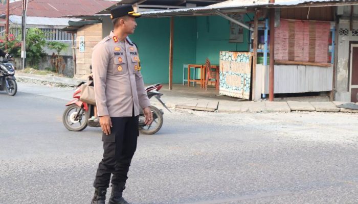 Sukseskan Program 100 Hari Kapolri, Kapolres Touna Turun Langsung Atur Lalu Lintas Pagi Hari